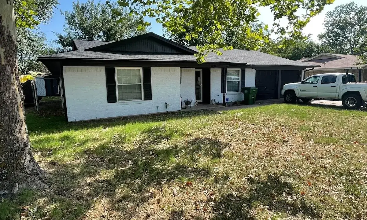 Professional roofing crew working on a residential roof in Albertville